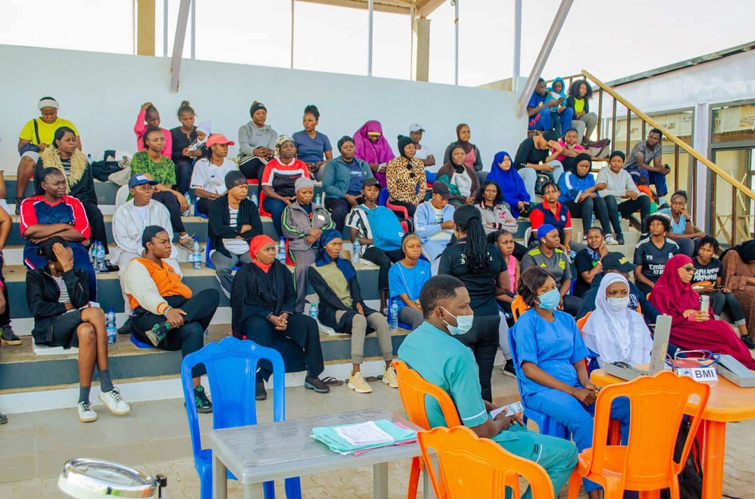 Attendees seated in the stands listening to a health talk