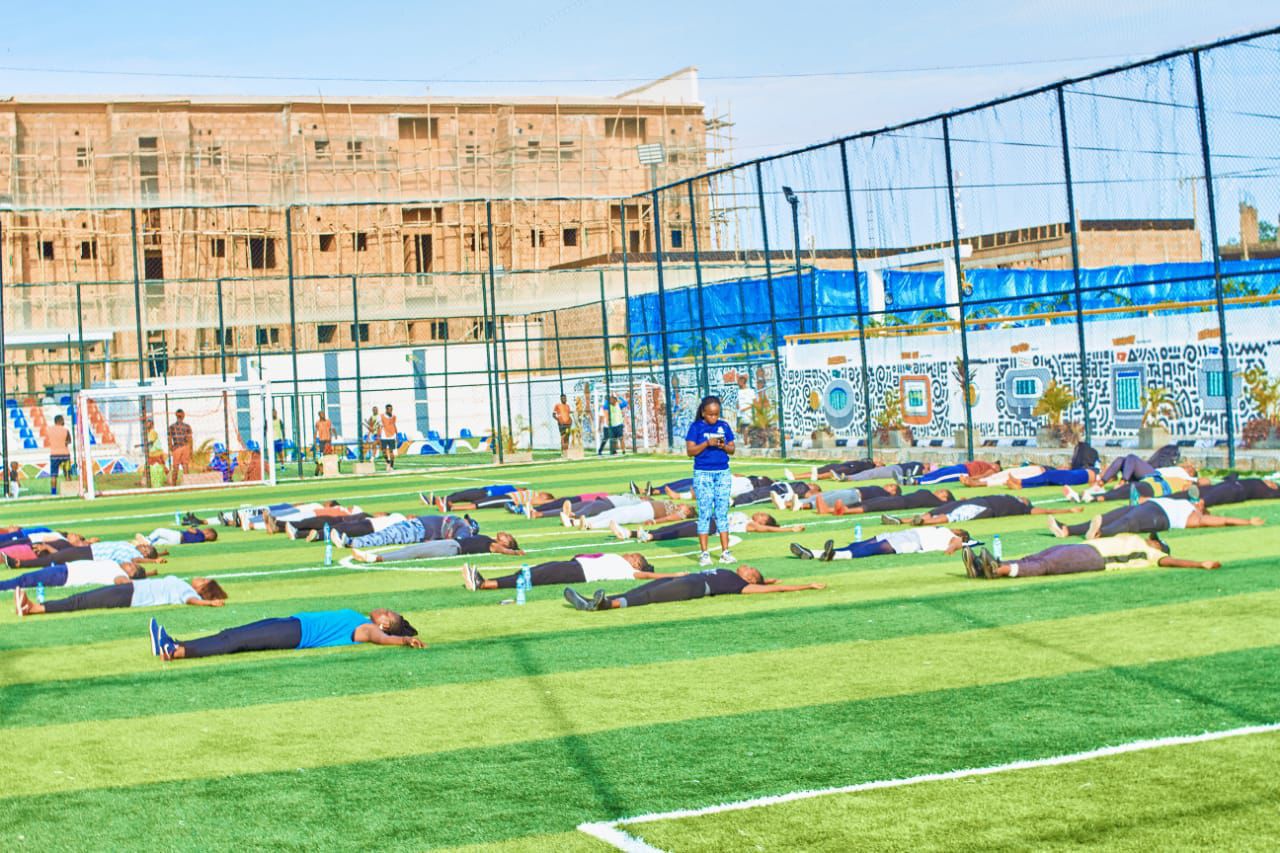 Health and wellness stretching session on the field