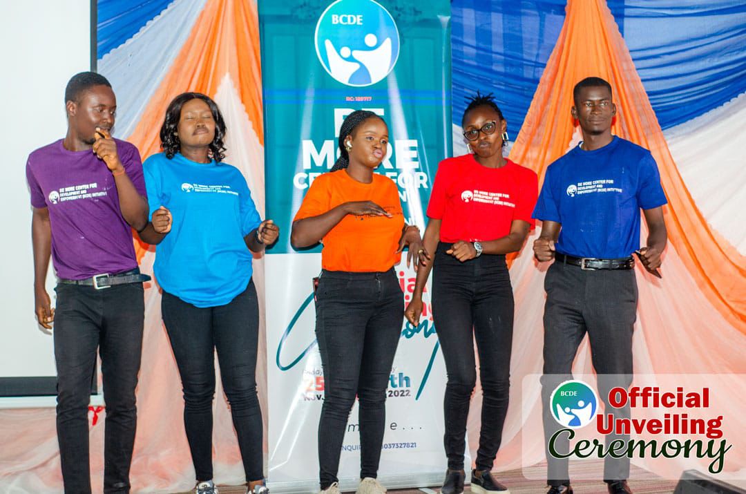 Volunteers performing on stage at the unveiling ceremony