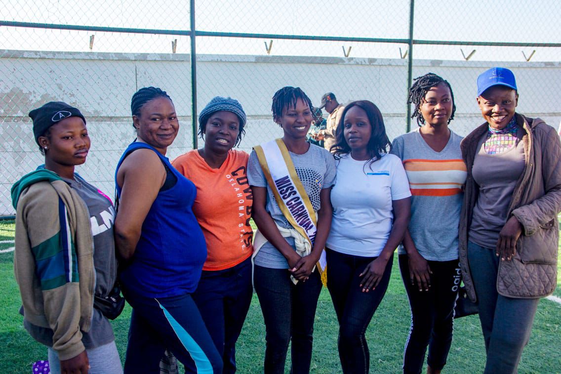 Group of women posing together on the field