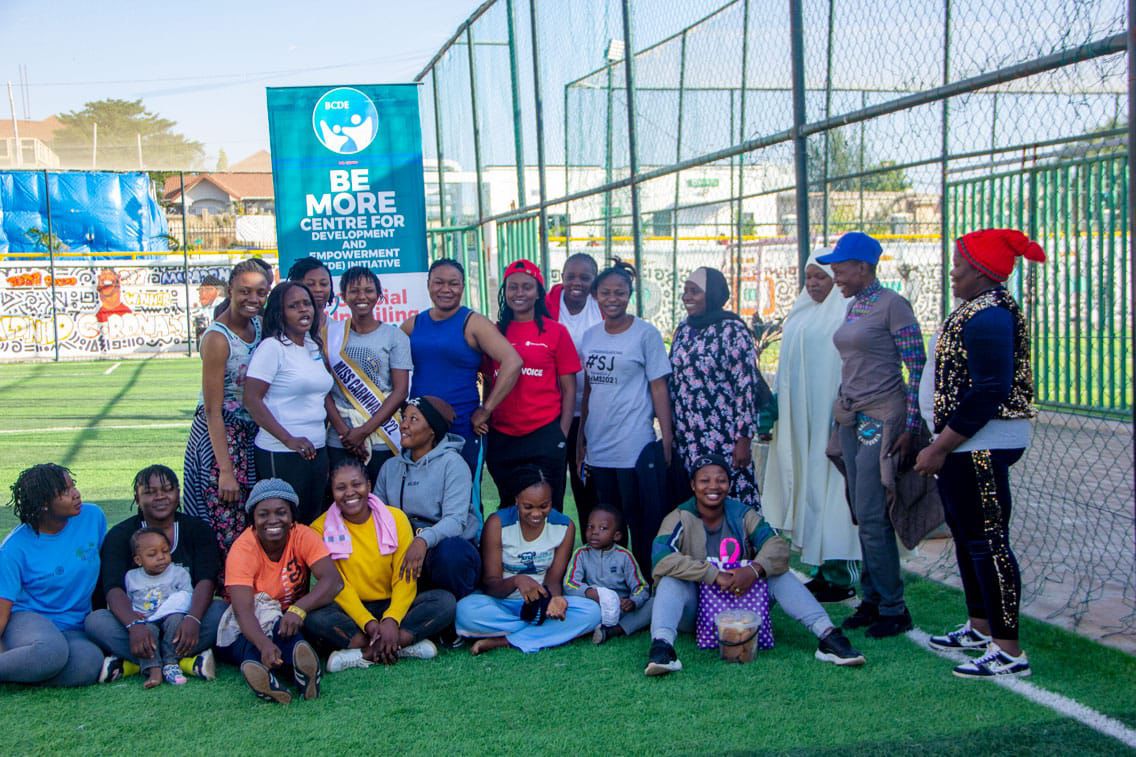 Community members posing together on the field